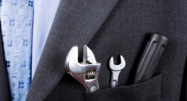 Business man well-dressed with tool kit
